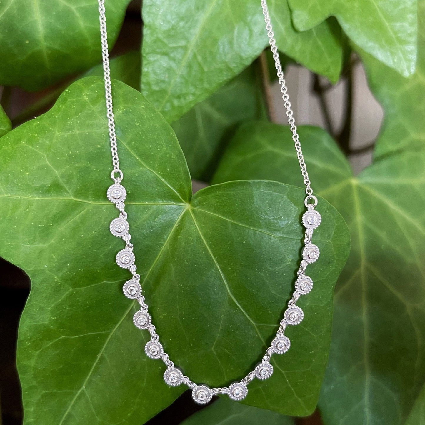 Photo of Diamond Necklace in a decorative scene, designed by , available at Plumb Gold & Plumb Silver