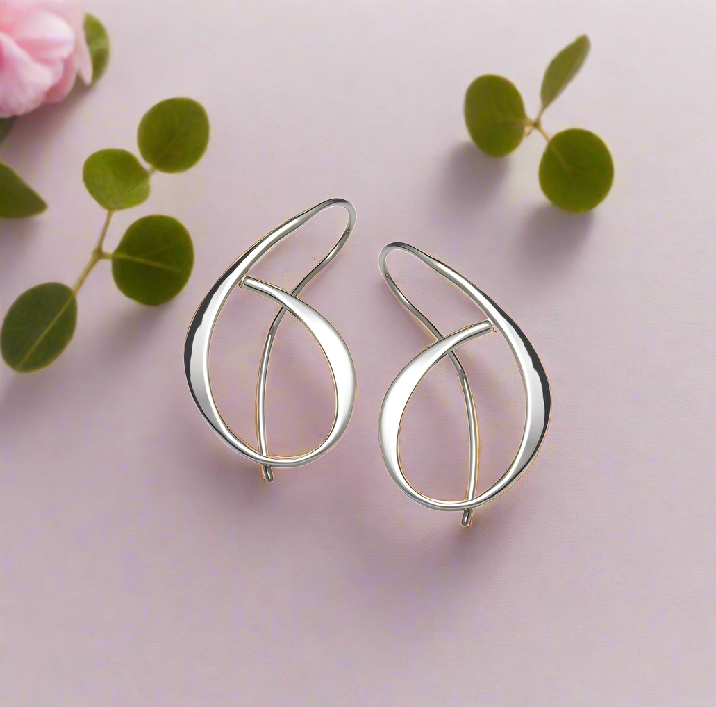 Photo of "Allegro" Earrings in a decorative scene, designed by , available at Plumb Gold & Plumb Silver