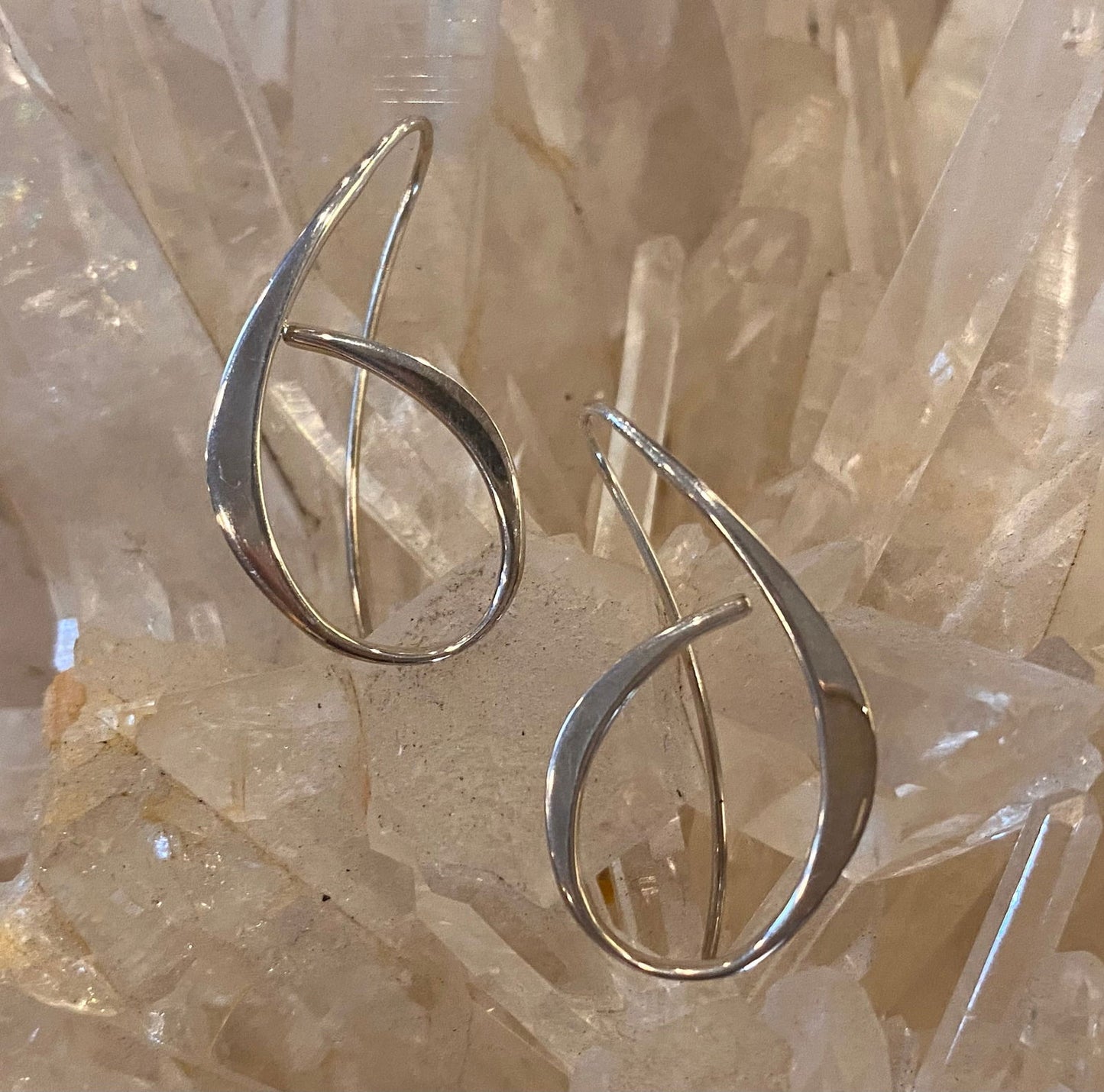 Photo of "Allegro" Earrings in a decorative scene, designed by , available at Plumb Gold & Plumb Silver