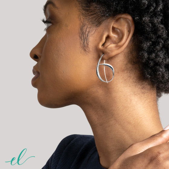 Photo of "Allegro" Earrings in a decorative scene, designed by , available at Plumb Gold & Plumb Silver