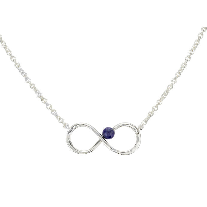 Photo of "Always" Necklace in a decorative scene, designed by , available at Plumb Gold & Plumb Silver