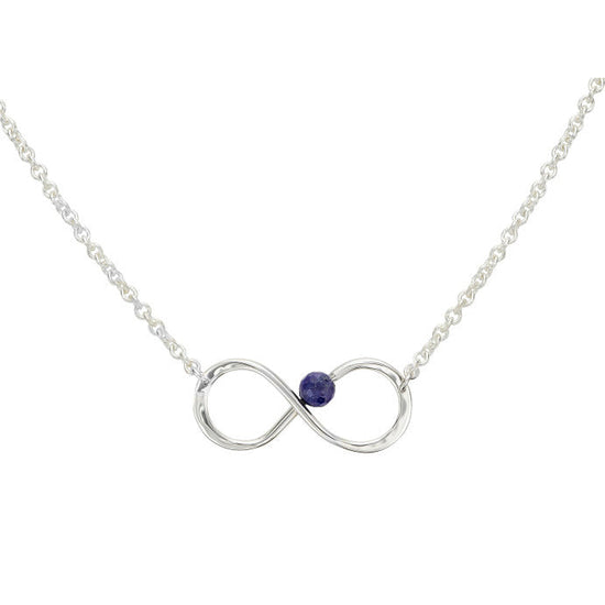 Photo of "Always" Necklace in a decorative scene, designed by , available at Plumb Gold & Plumb Silver