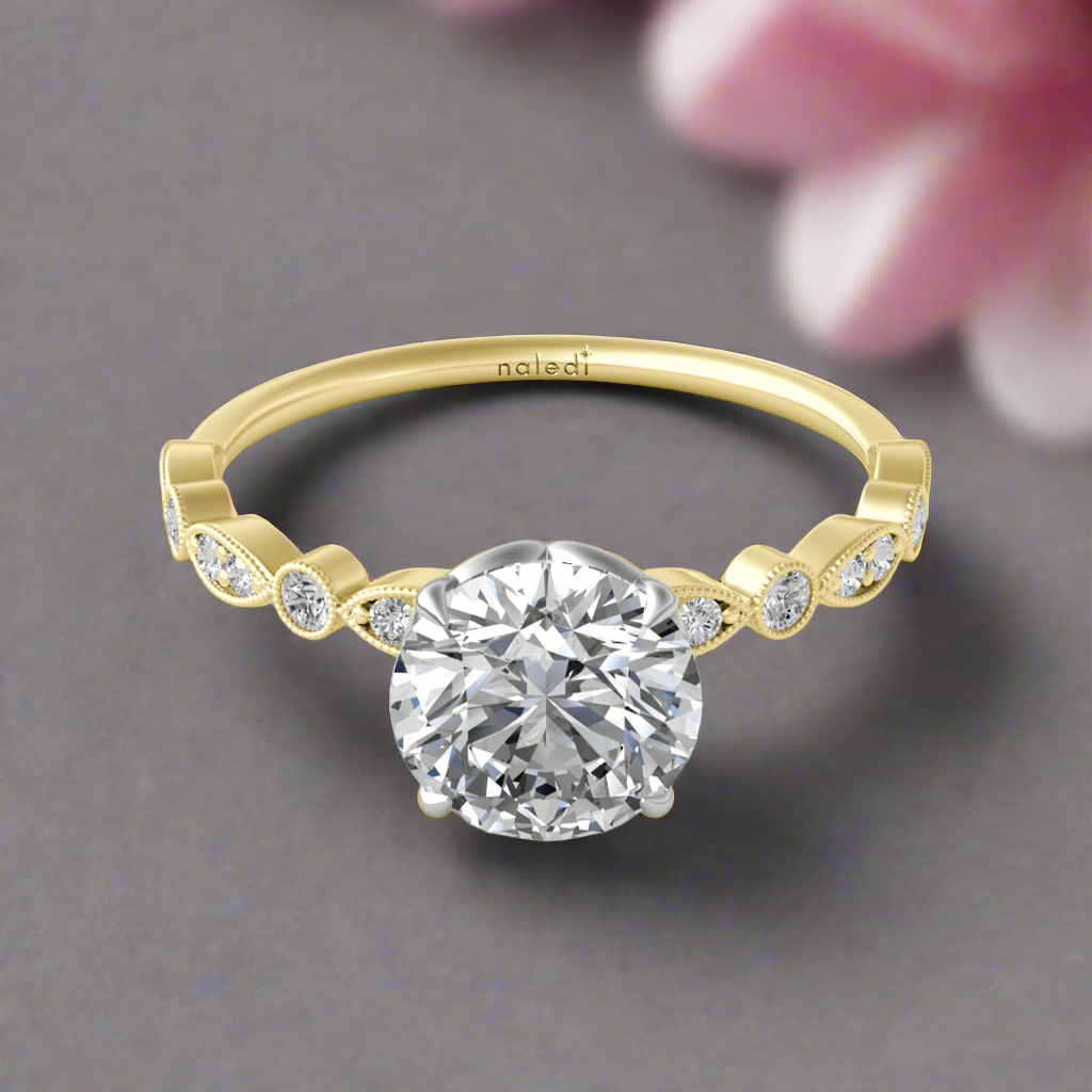 Photo of "Andrea" Engagement Mounting in a decorative scene, designed by , available at Plumb Gold & Plumb Silver