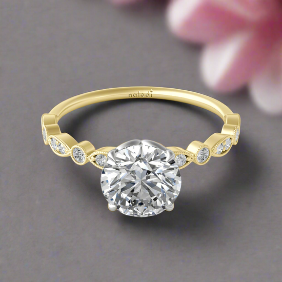 Photo of "Andrea" Engagement Mounting in a decorative scene, designed by , available at Plumb Gold & Plumb Silver