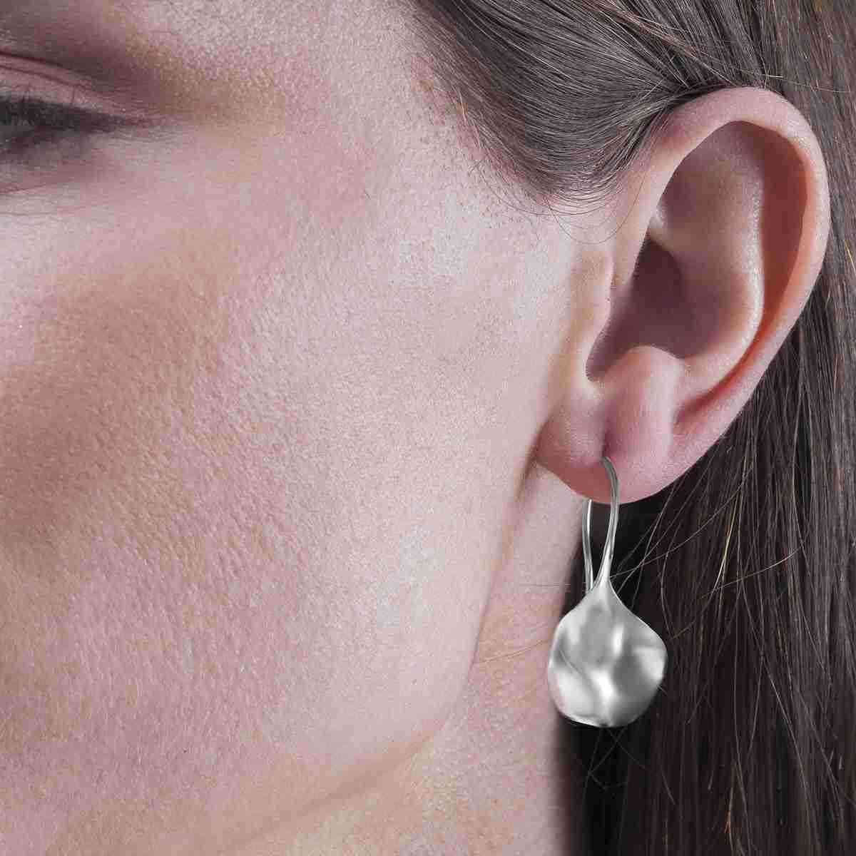 Photo of "Aqua" Earrings in a decorative scene, designed by -, available at Plumb Gold & Plumb Silver