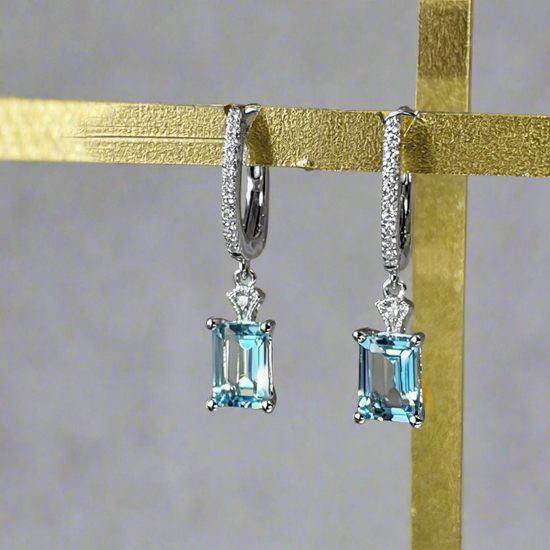 Photo of Aquamarine Dangles in a decorative scene, designed by -, available at Plumb Gold & Plumb Silver