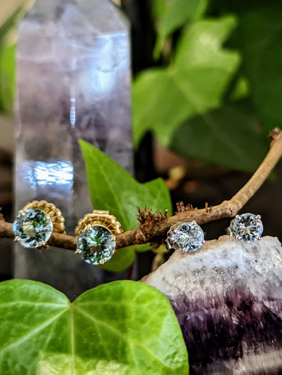 Photo of Aquamarine Studs in a decorative scene, designed by , available at Plumb Gold & Plumb Silver