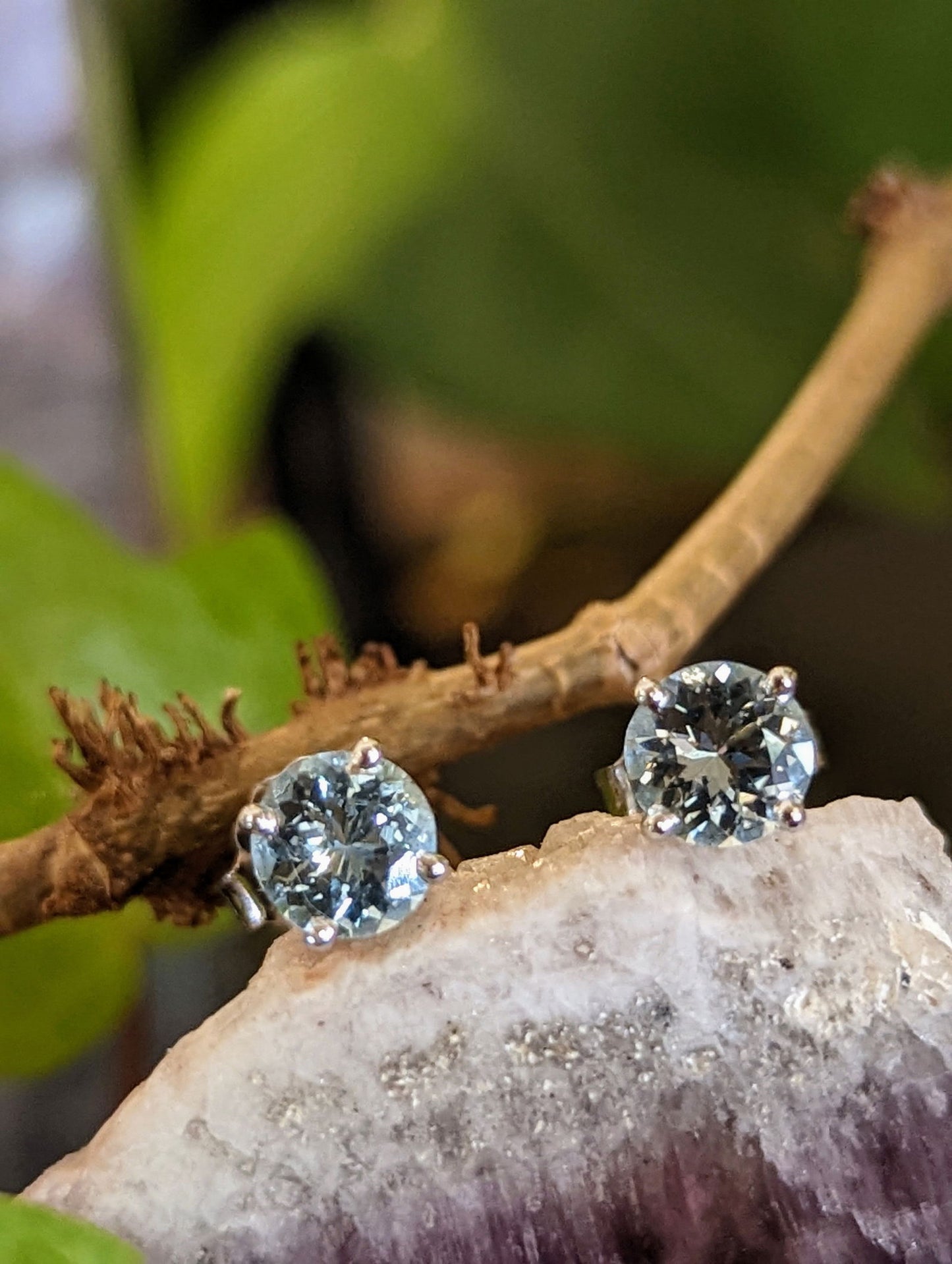 Photo of Aquamarine Studs in a decorative scene, designed by , available at Plumb Gold & Plumb Silver