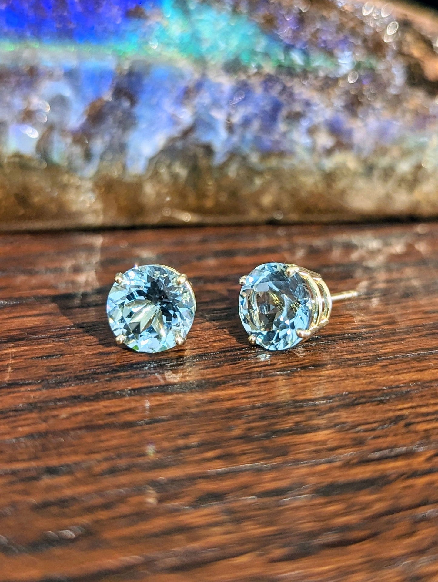 Photo of Aquamarine Studs in a decorative scene, designed by , available at Plumb Gold & Plumb Silver