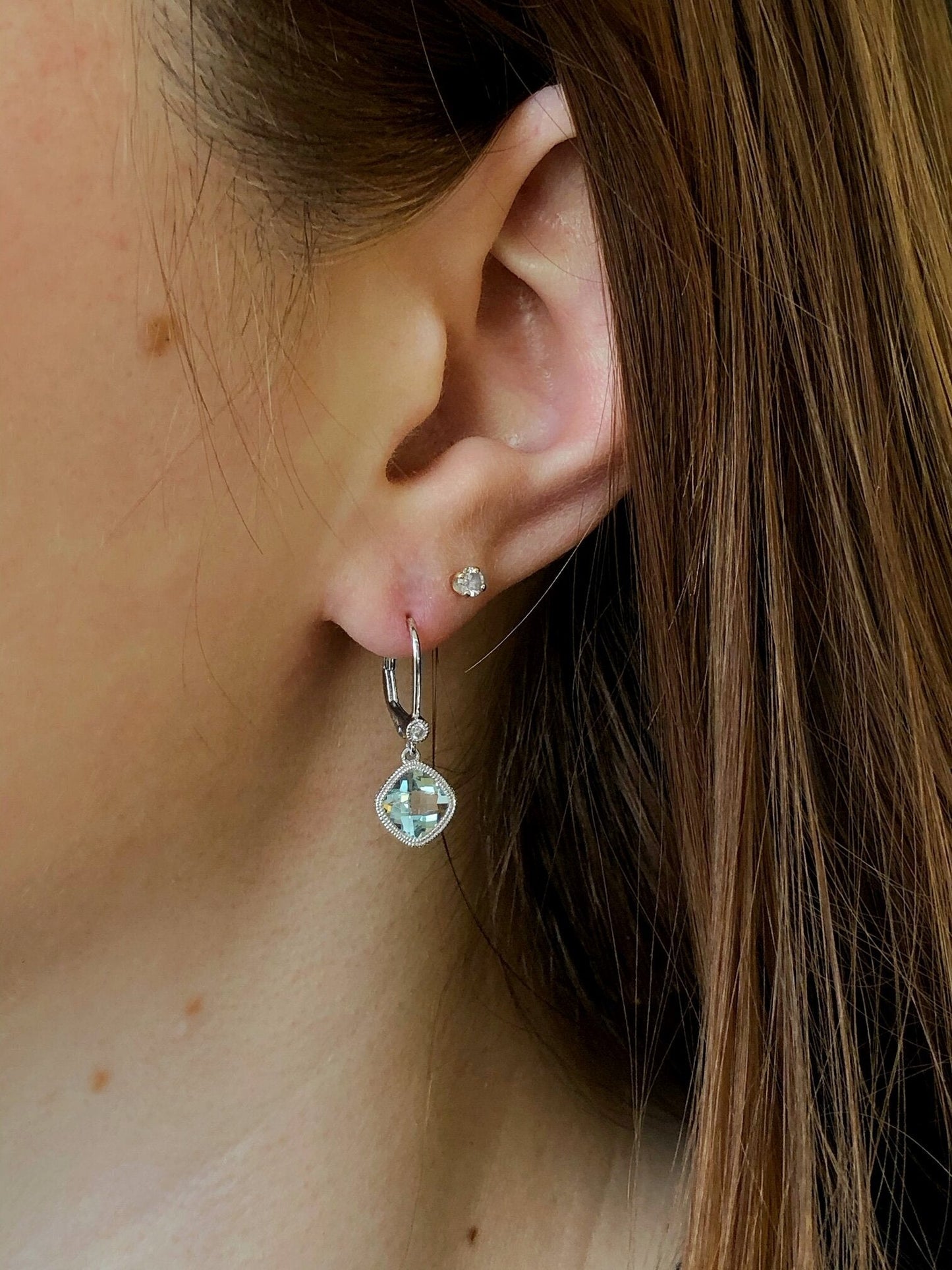 Photo of Aquamarine and Diamond Dangles in a decorative scene, designed by , available at Plumb Gold & Plumb Silver