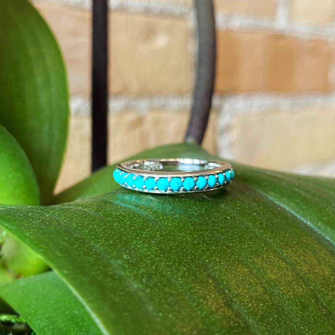 Photo of Beaded Turquoise Ring in a decorative scene, designed by , available at Plumb Gold & Plumb Silver