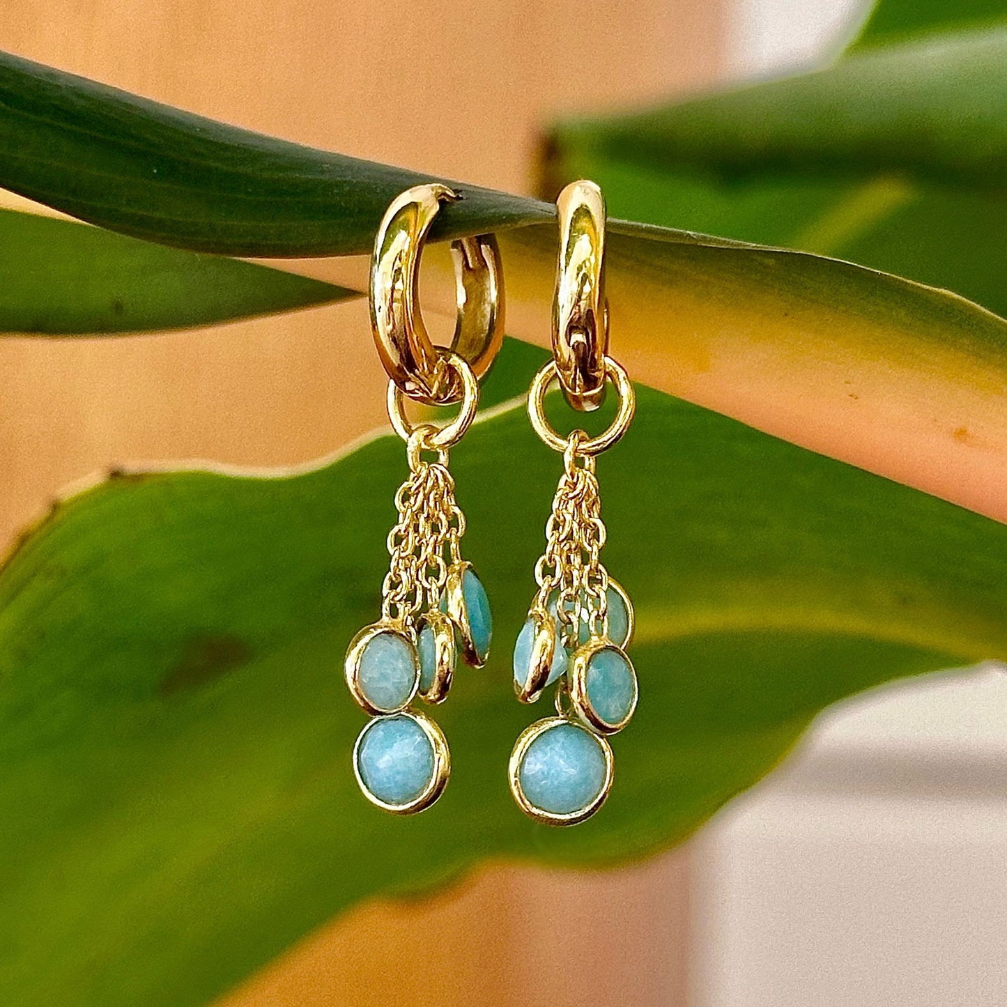 Photo of “Bella” Charm Dangles in a decorative scene, designed by -, available at Plumb Gold & Plumb Silver