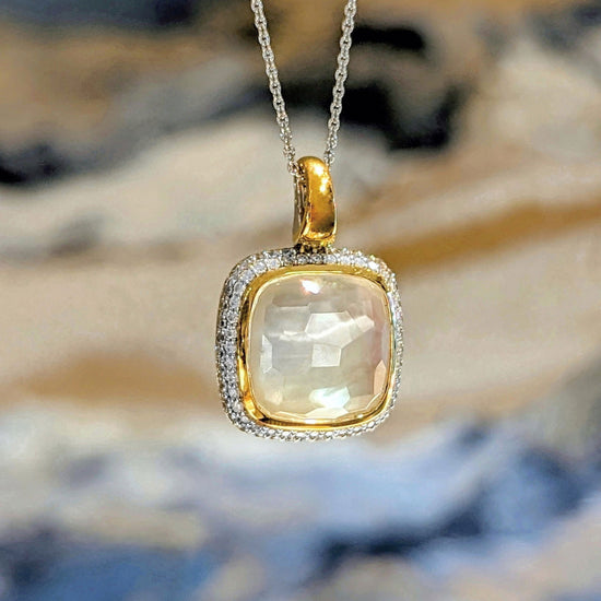 Photo of Bezel CZ Halo Pendant in a decorative scene, designed by , available at Plumb Gold & Plumb Silver