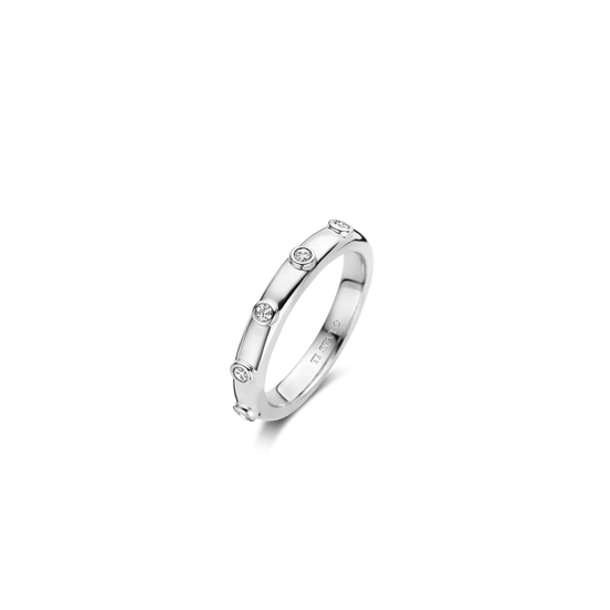 Photo of Bezel Station Stackable Ring in a decorative scene, designed by , available at Plumb Gold & Plumb Silver