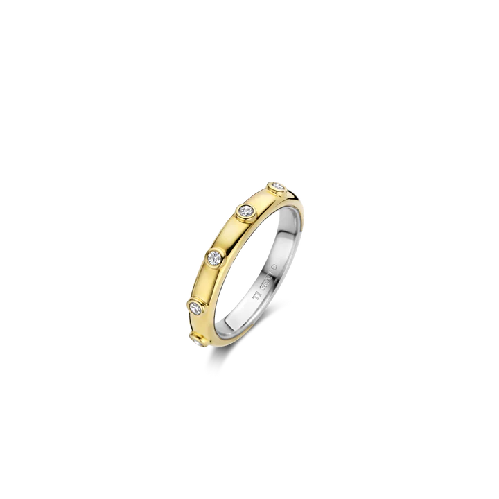Photo of Bezel Station Stackable Ring in a decorative scene, designed by , available at Plumb Gold & Plumb Silver