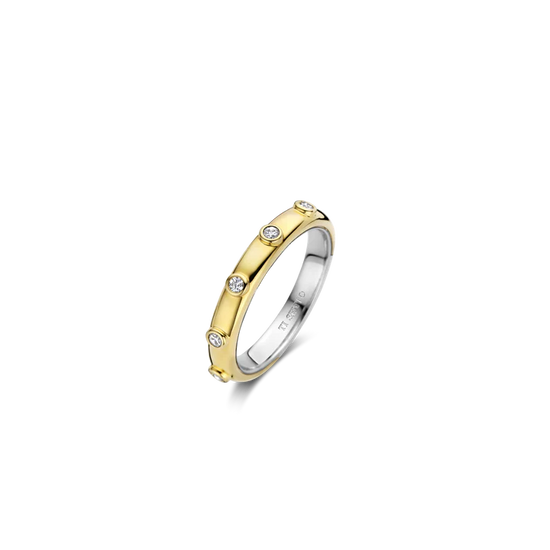 Photo of Bezel Station Stackable Ring in a decorative scene, designed by , available at Plumb Gold & Plumb Silver
