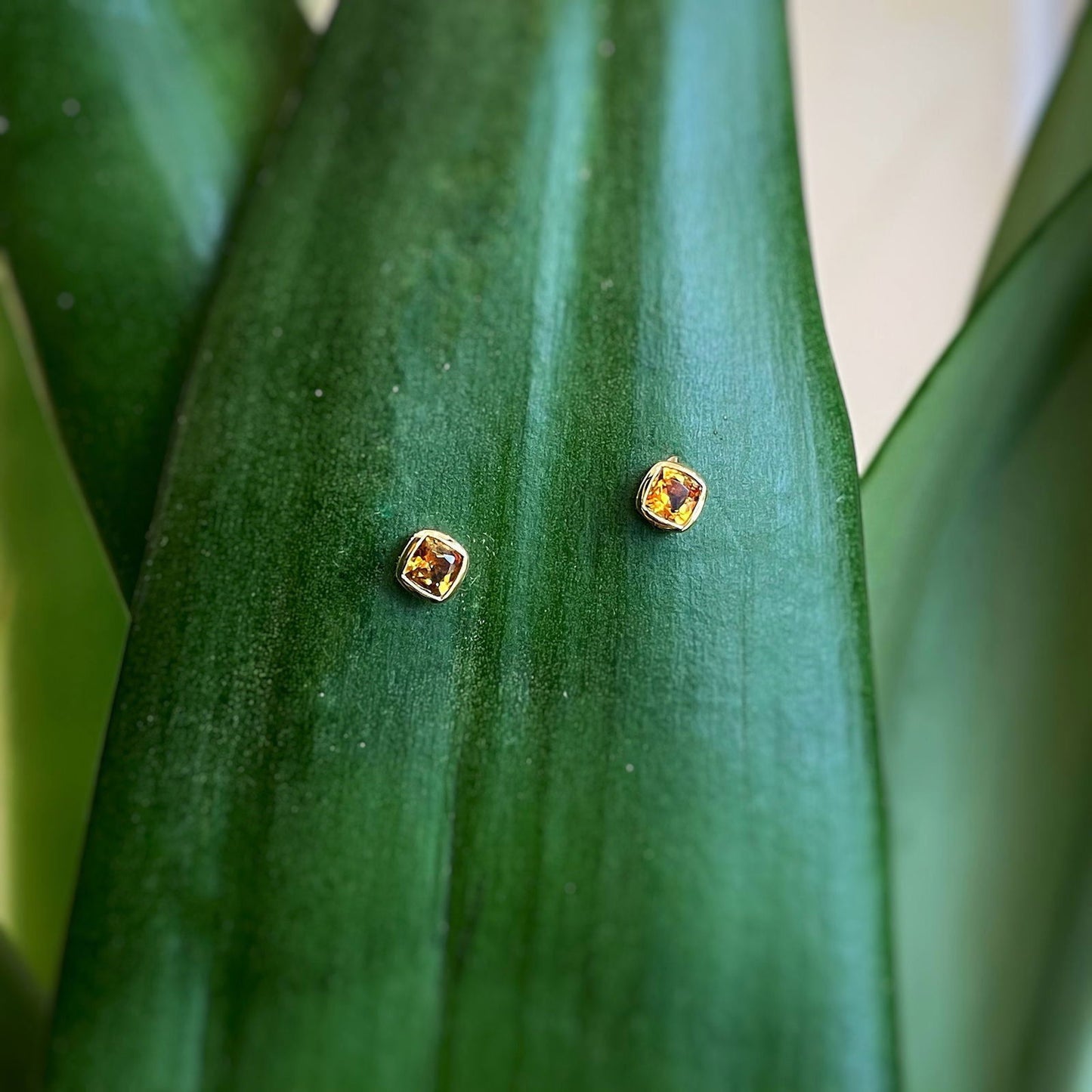 Photo of Bezel Studs in a decorative scene, designed by -, available at Plumb Gold & Plumb Silver