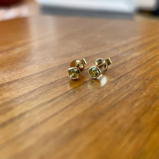 Photo of Bezel Studs in a decorative scene, designed by -, available at Plumb Gold & Plumb Silver
