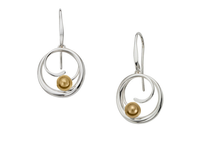 Photo of "Bindu" Earrings in a decorative scene, designed by , available at Plumb Gold & Plumb Silver