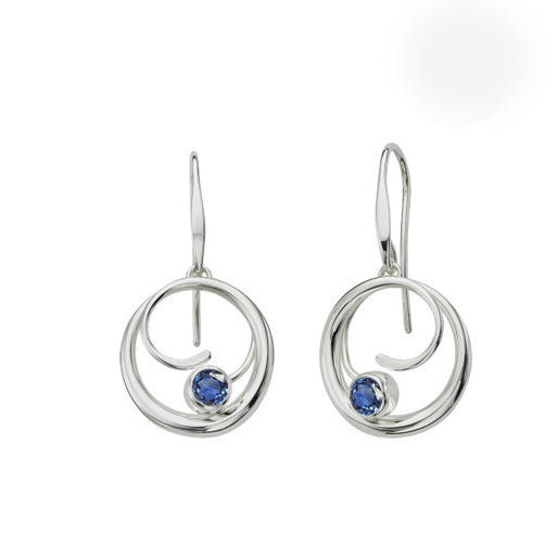Photo of "Bindu" Earrings in a decorative scene, designed by , available at Plumb Gold & Plumb Silver