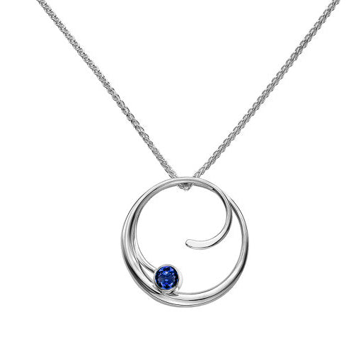Photo of "Bindu" Necklace in a decorative scene, designed by , available at Plumb Gold & Plumb Silver