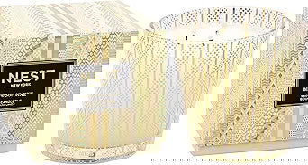 Photo of Birchwood Pine Candle in a decorative scene, designed by , available at Plumb Gold & Plumb Silver