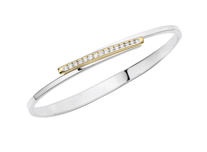 Photo of "Bling Swing" Bangle in a decorative scene, designed by , available at Plumb Gold & Plumb Silver