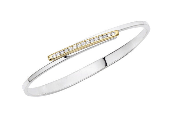 Photo of "Bling Swing" Bangle in a decorative scene, designed by , available at Plumb Gold & Plumb Silver