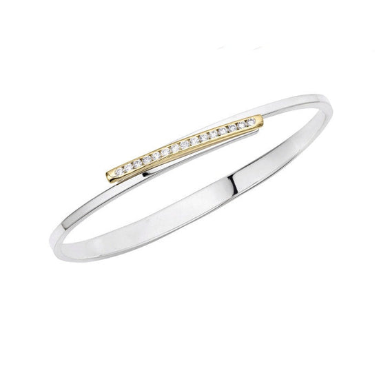 Photo of "Bling Swing" Bangle in a decorative scene, designed by , available at Plumb Gold & Plumb Silver