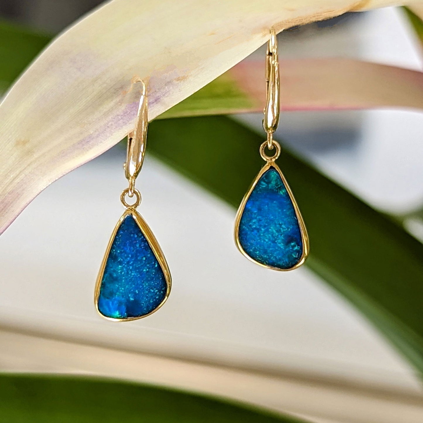 Photo of Blue Opal Dangles in a decorative scene, designed by , available at Plumb Gold & Plumb Silver