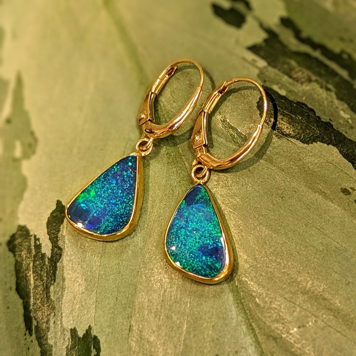 Photo of Blue Opal Dangles in a decorative scene, designed by , available at Plumb Gold & Plumb Silver