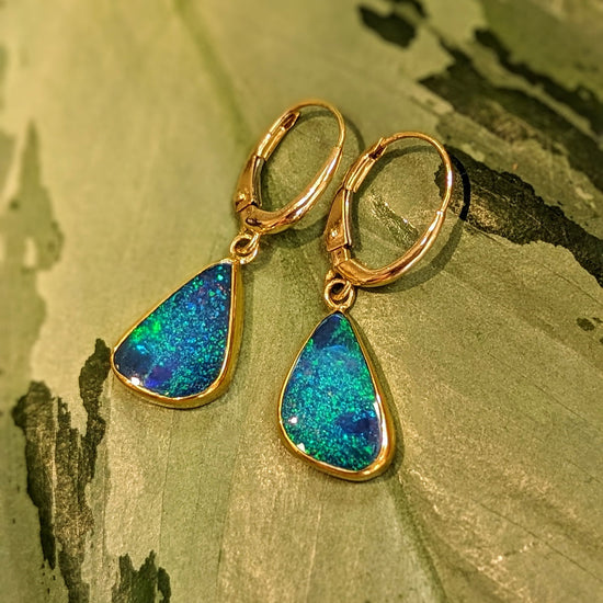 Photo of Blue Opal Dangles in a decorative scene, designed by , available at Plumb Gold & Plumb Silver