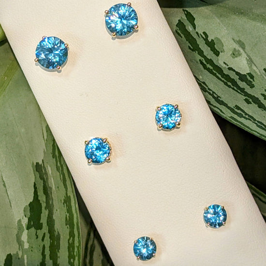 Photo of Blue Zircon Studs in a decorative scene, designed by , available at Plumb Gold & Plumb Silver