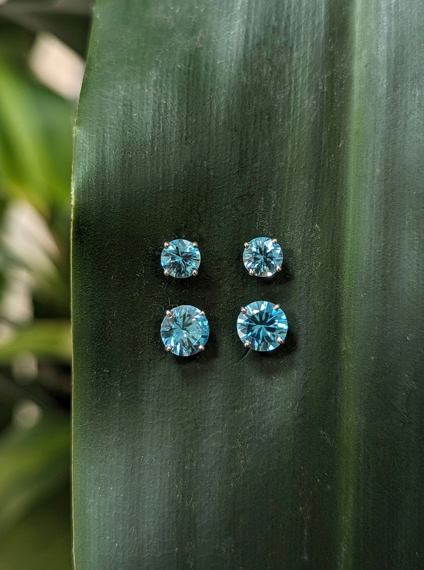 Photo of Blue Zircon Studs in a decorative scene, designed by , available at Plumb Gold & Plumb Silver