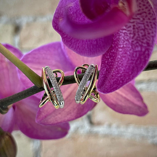 Photo of Breuning Abstract Diamond Cross Earrings in a decorative scene, designed by , available at Plumb Gold & Plumb Silver