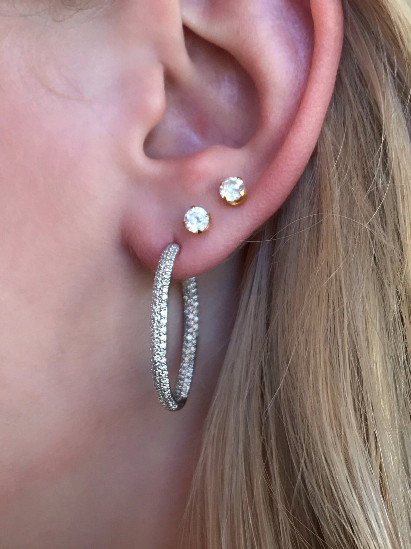 Photo of Breuning In and Out Diamond Hoops in a decorative scene, designed by , available at Plumb Gold & Plumb Silver
