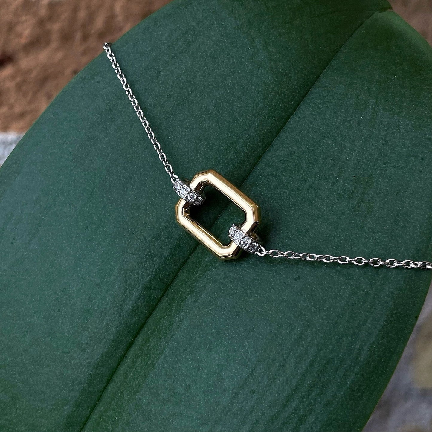 Photo of CZ Rectangle Bracelet in a decorative scene, designed by , available at Plumb Gold & Plumb Silver