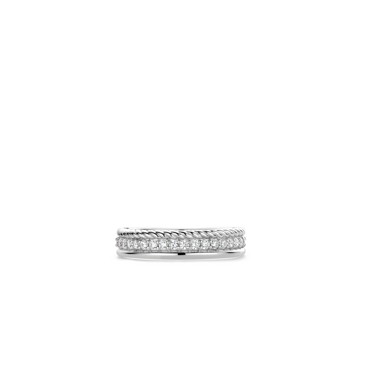 Photo of CZ braided Line Ring in a decorative scene, designed by , available at Plumb Gold & Plumb Silver