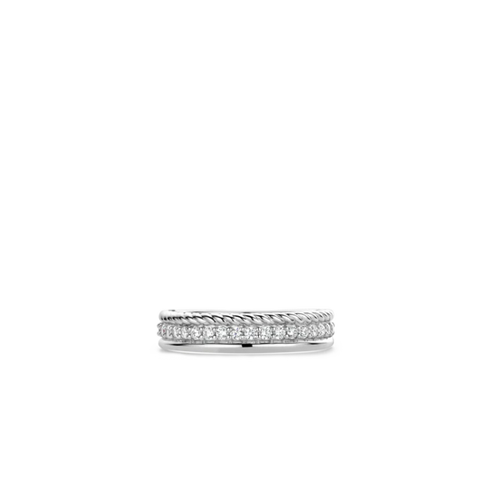 Photo of CZ braided Line Ring in a decorative scene, designed by , available at Plumb Gold & Plumb Silver