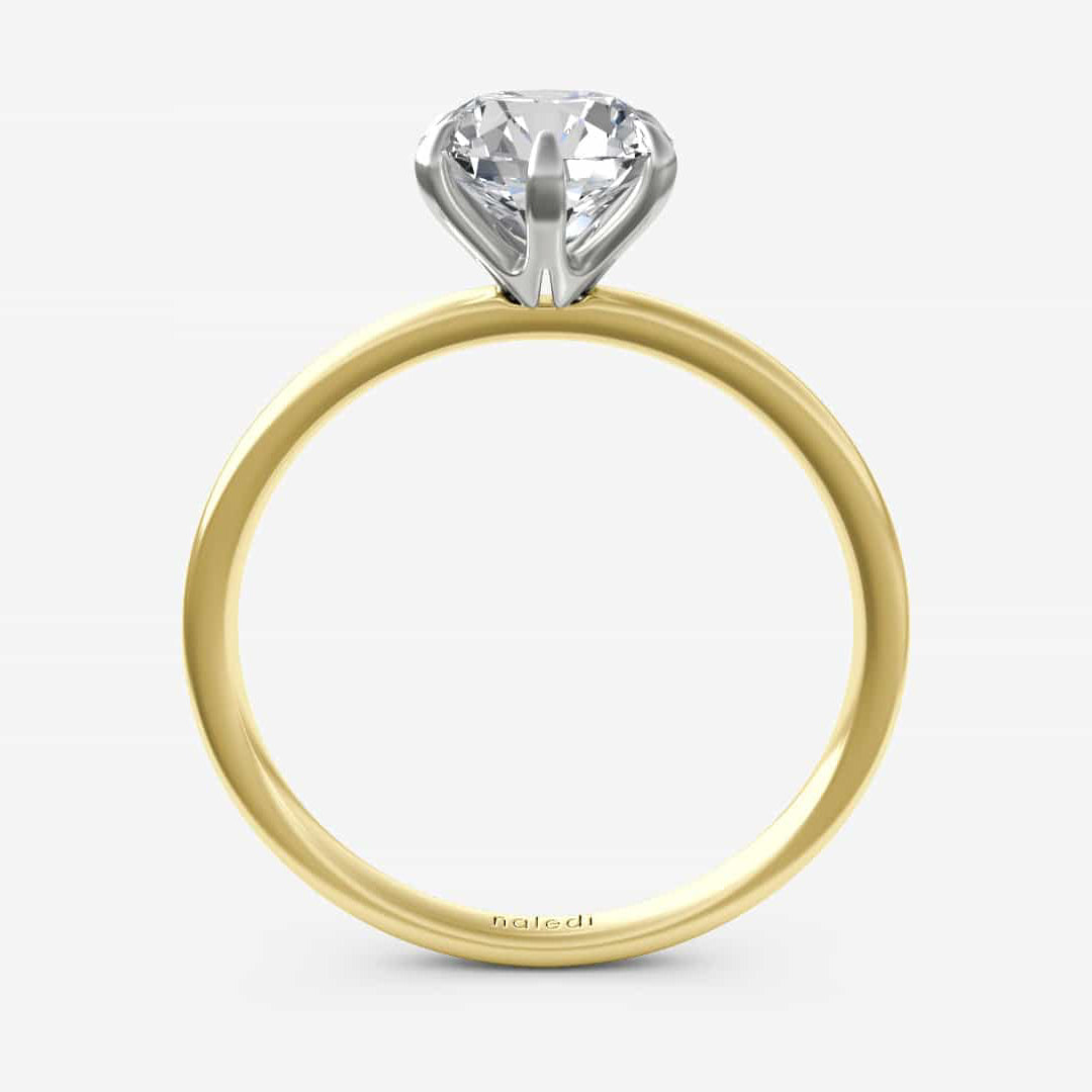 Photo of "Candice" Solitaire in a decorative scene, designed by , available at Plumb Gold & Plumb Silver