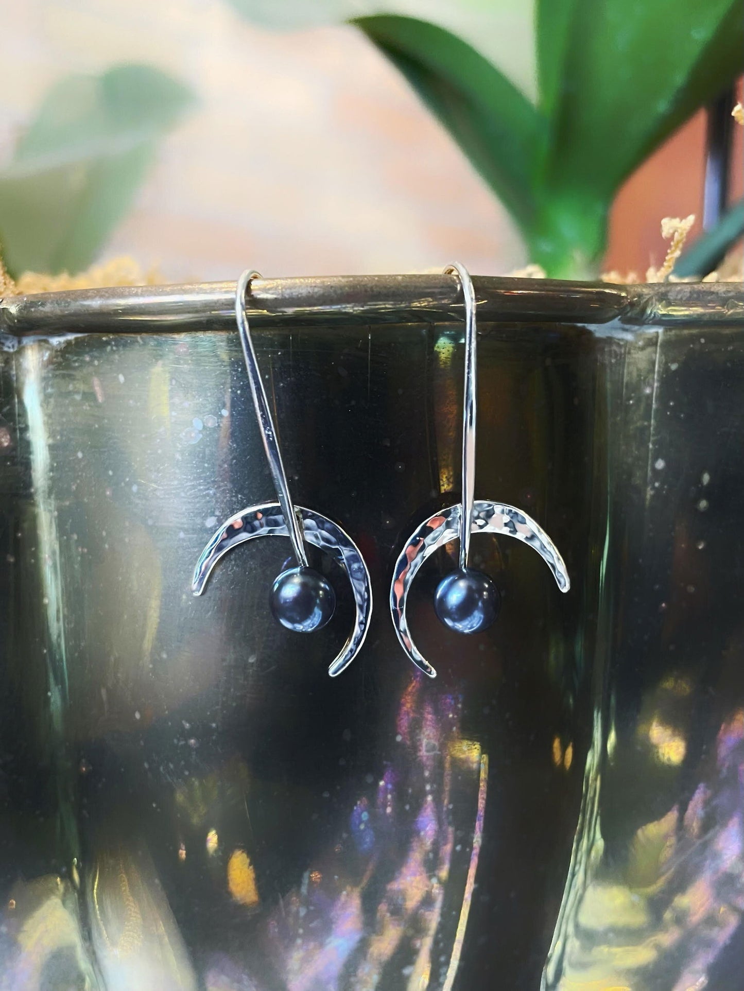 Photo of "Celestial" Earrings in a decorative scene, designed by , available at Plumb Gold & Plumb Silver