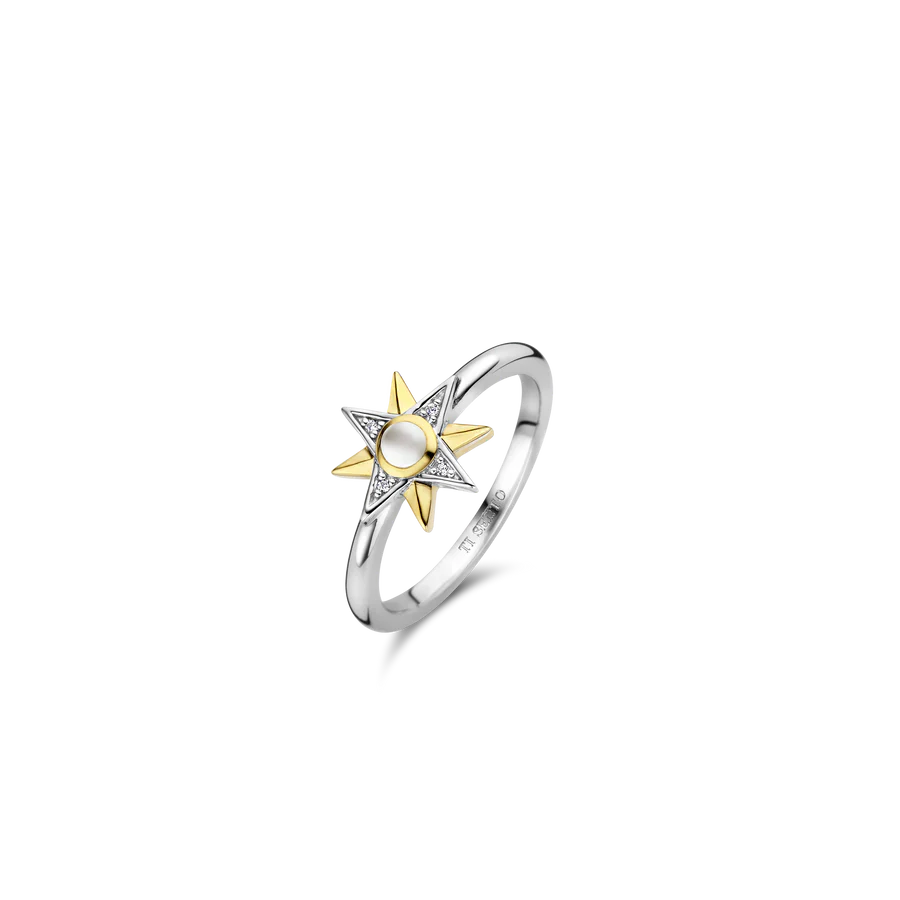 Photo of Celestial Star Ring in a decorative scene, designed by , available at Plumb Gold & Plumb Silver
