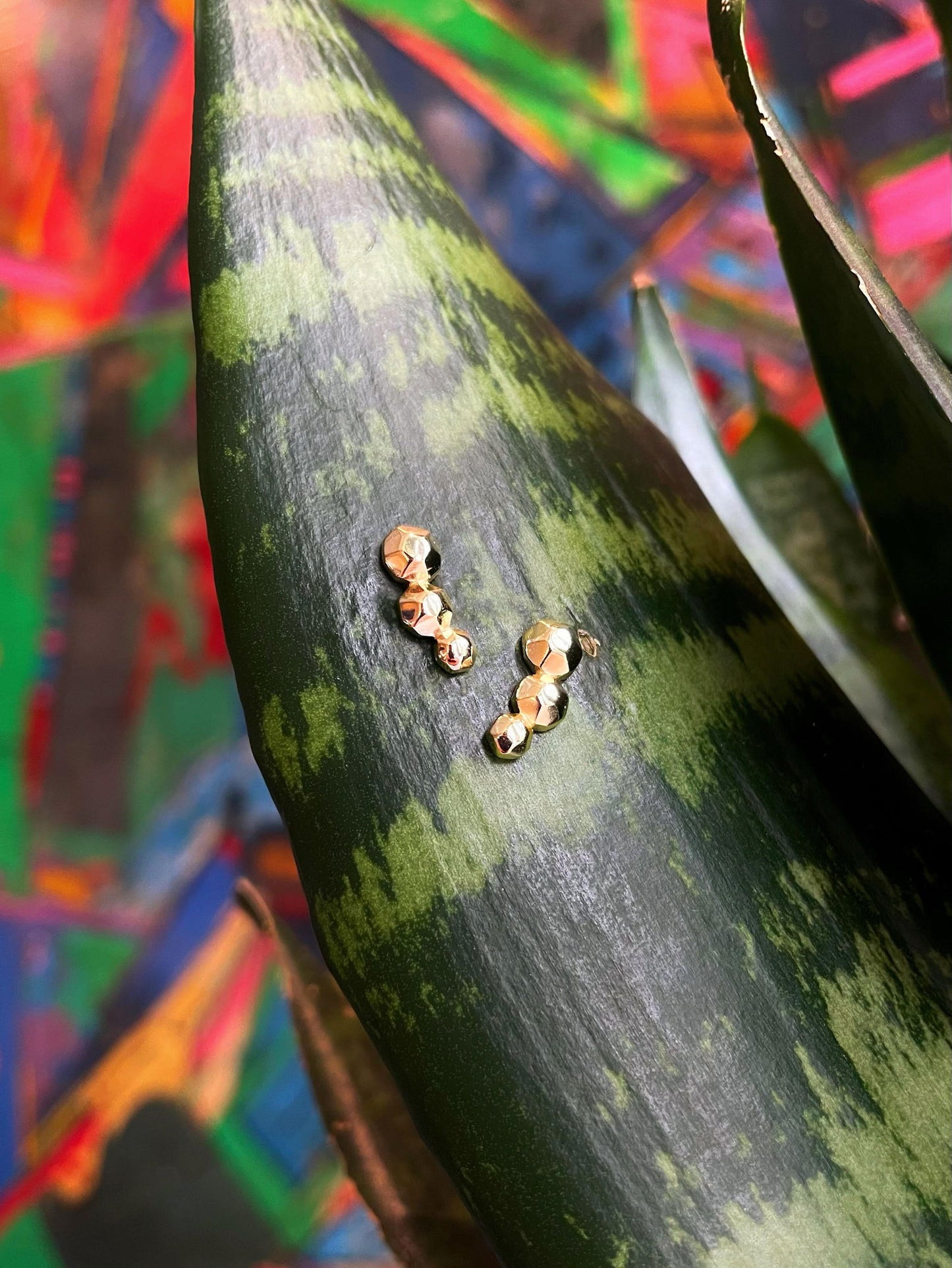 Photo of "Celestial" Stud Earrings in a decorative scene, designed by , available at Plumb Gold & Plumb Silver