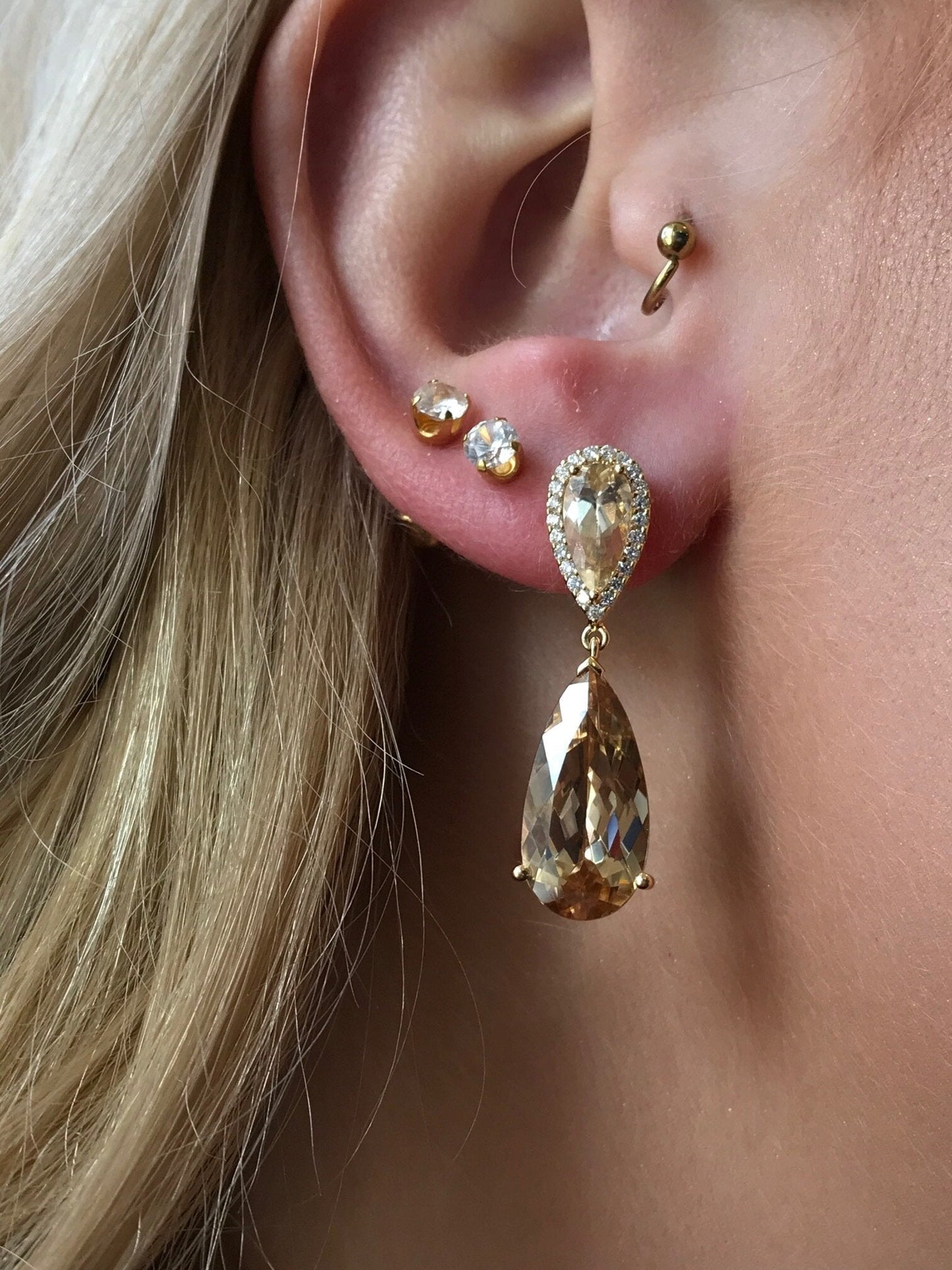 Photo of Champagne Zircon Dangles in a decorative scene, designed by , available at Plumb Gold & Plumb Silver