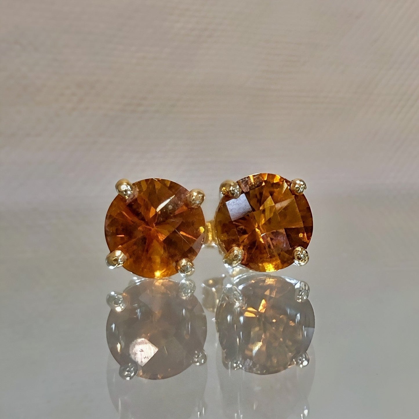 Photo of Checkerboard-Cut Citrine Studs in a decorative scene, designed by -, available at Plumb Gold & Plumb Silver