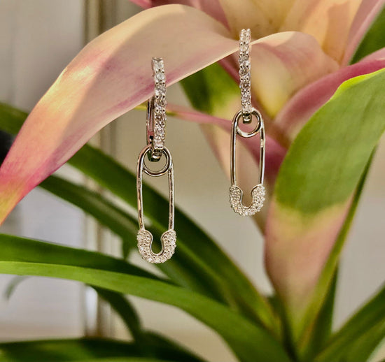 Photo of Chic pin charm in a decorative scene, designed by , available at Plumb Gold & Plumb Silver