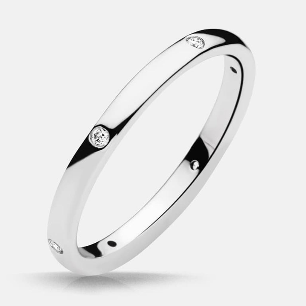 Photo of "Claire" Band in a decorative scene, designed by , available at Plumb Gold & Plumb Silver