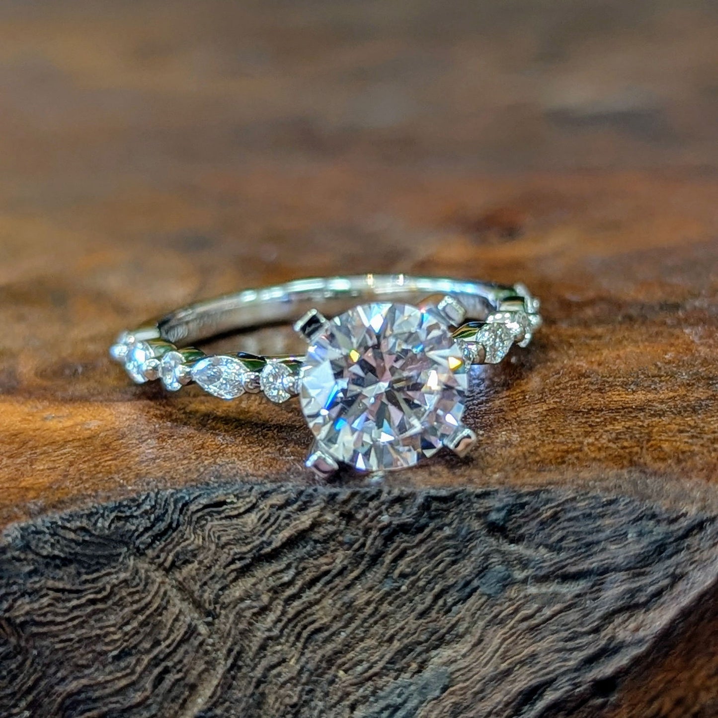 Photo of "Clarice" Solitaire Mounting in a decorative scene, designed by , available at Plumb Gold & Plumb Silver