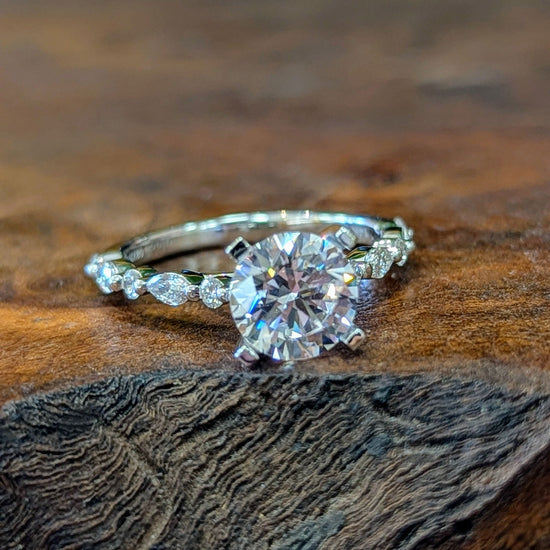 Photo of "Clarice" Solitaire Mounting in a decorative scene, designed by , available at Plumb Gold & Plumb Silver