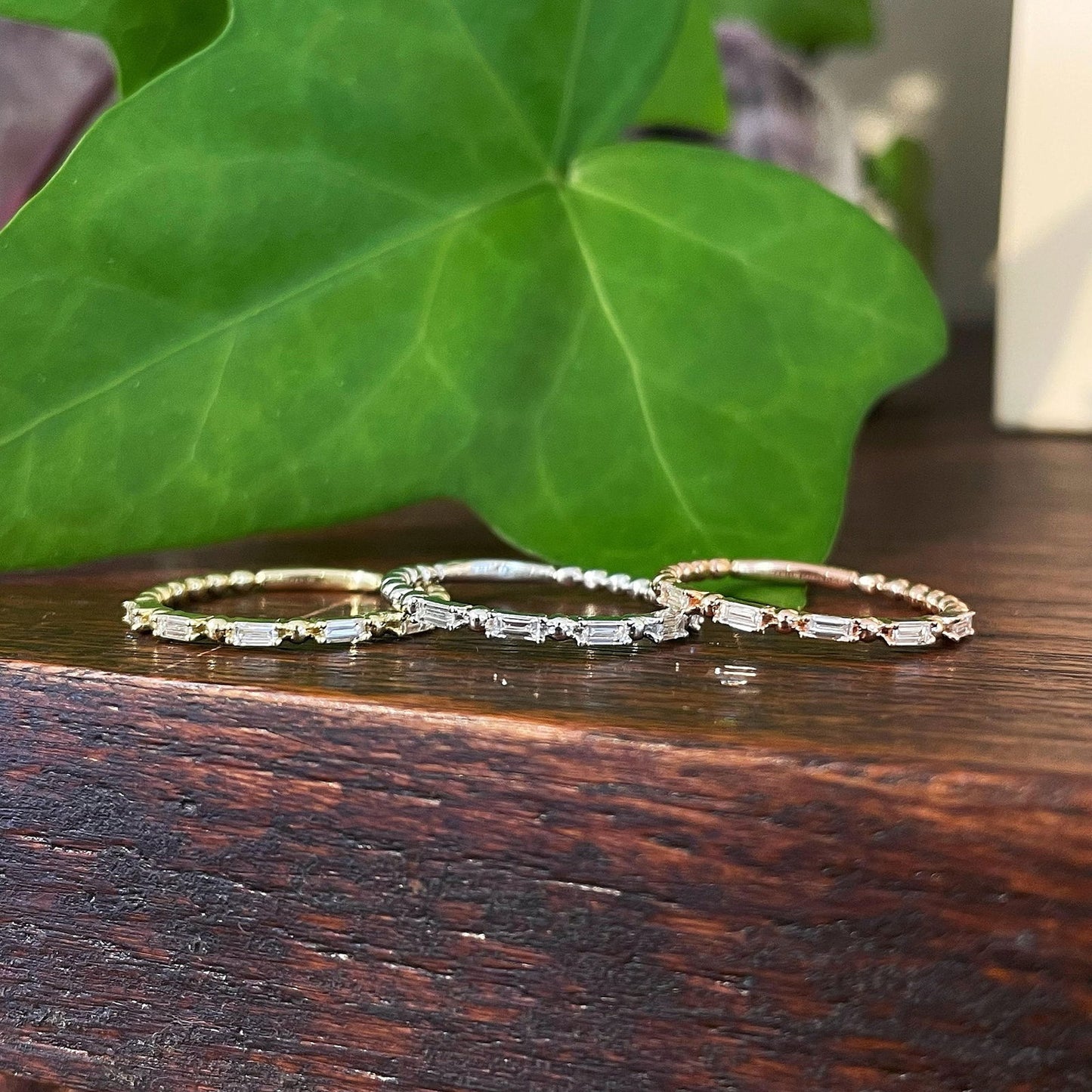 Photo of "Collette" Baguette Band in a decorative scene, designed by , available at Plumb Gold & Plumb Silver